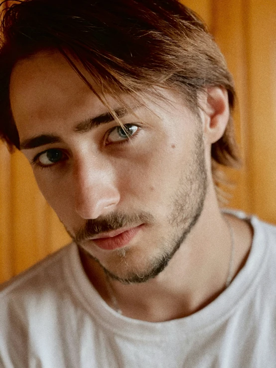 a close - up picture of a man with a long, hair and a beard