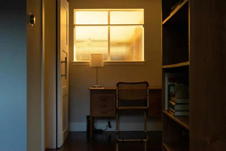 a room with a desk and some shelves