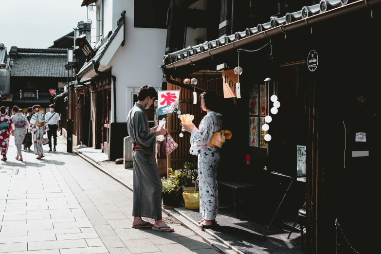 a lady talking to a man on the street