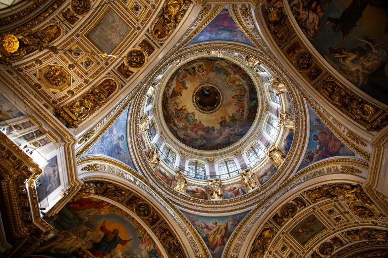 looking up at the ceiling and dome of a church