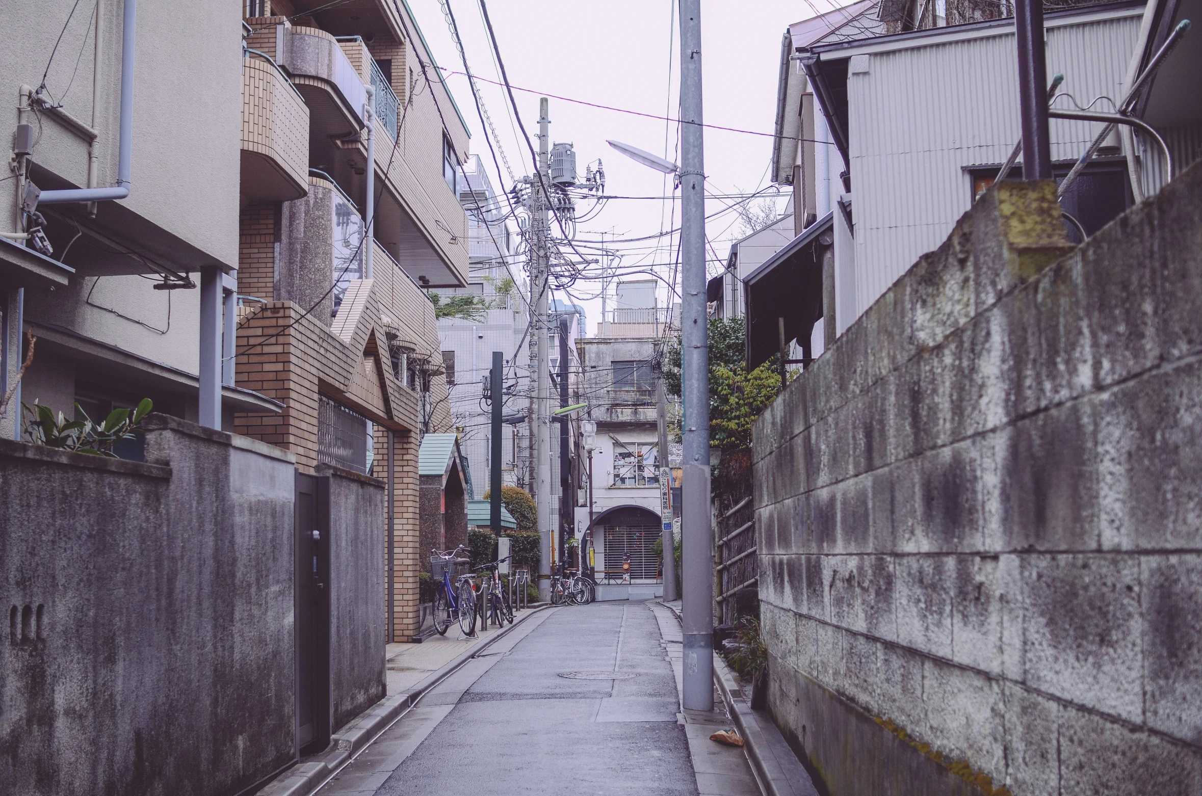 a long street with a large sign on the side