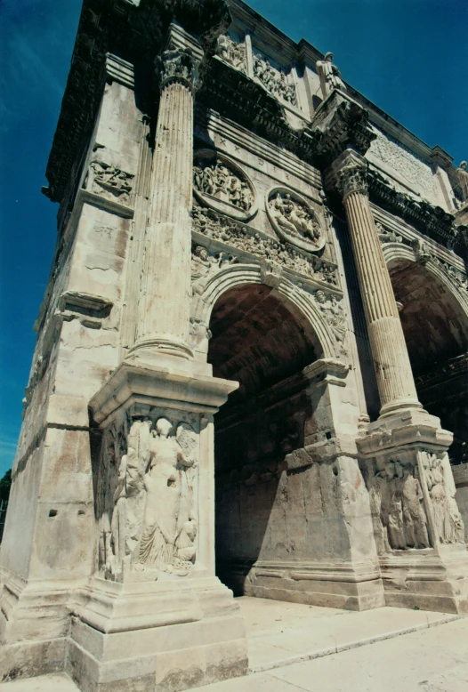 stone statues are lined up at the entrance to a building