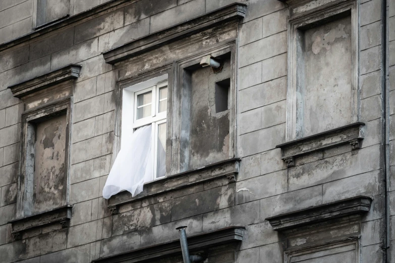 an old building with clothes hung out of windows