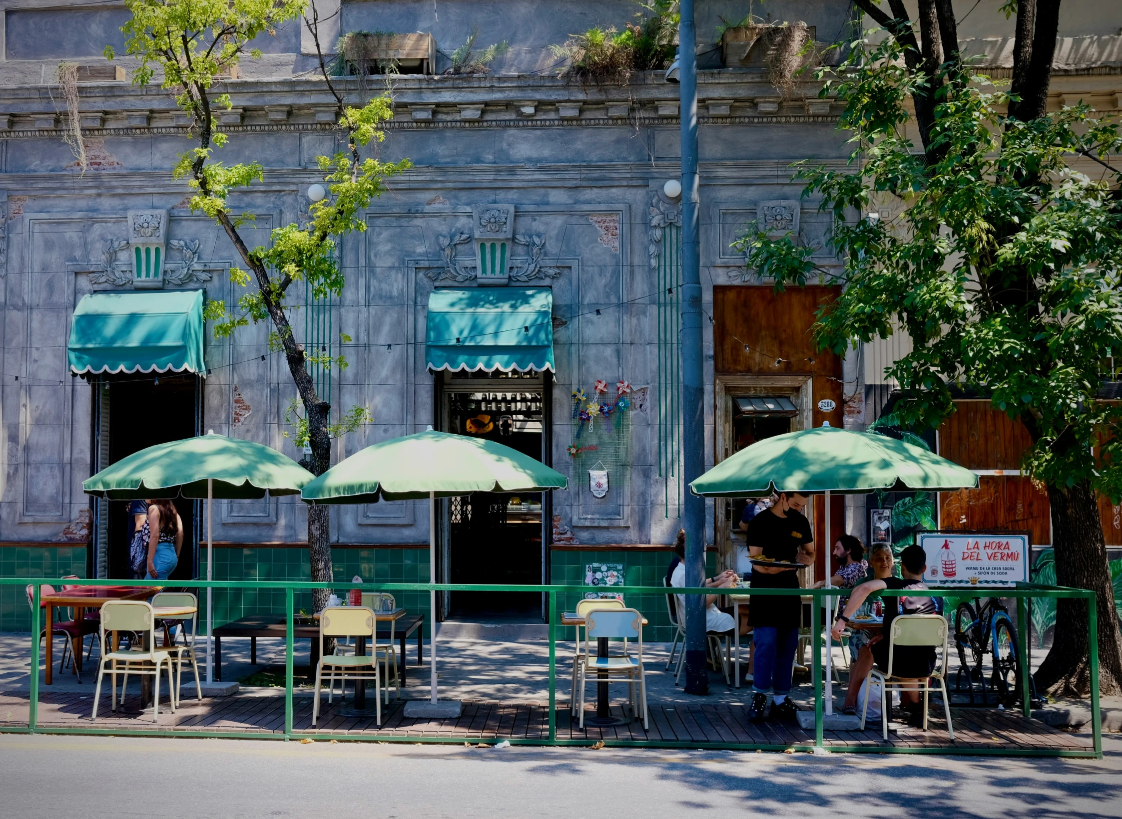 an image of people eating outside in the sun