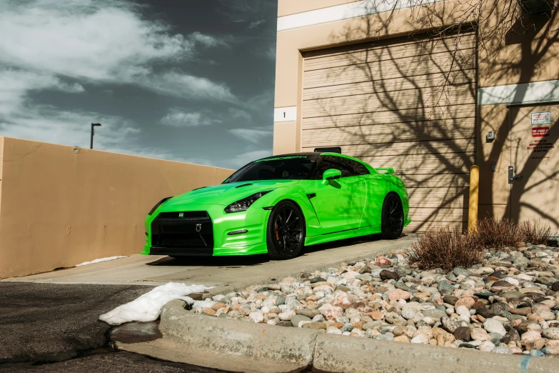 a bright green car parked on the side of a road