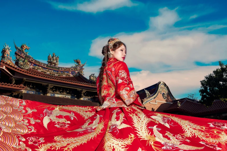 a woman in a oriental costume with a red dress