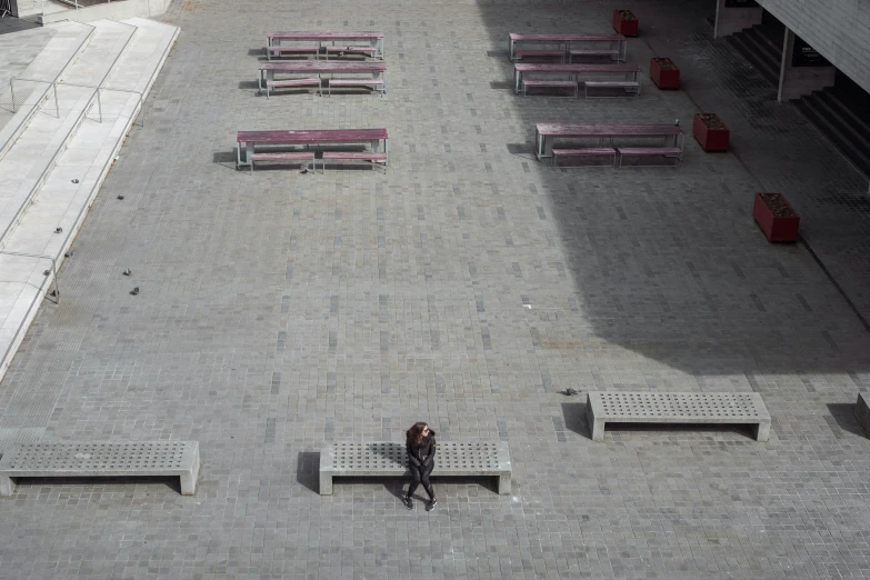 an overhead view of benches on the brick walk way