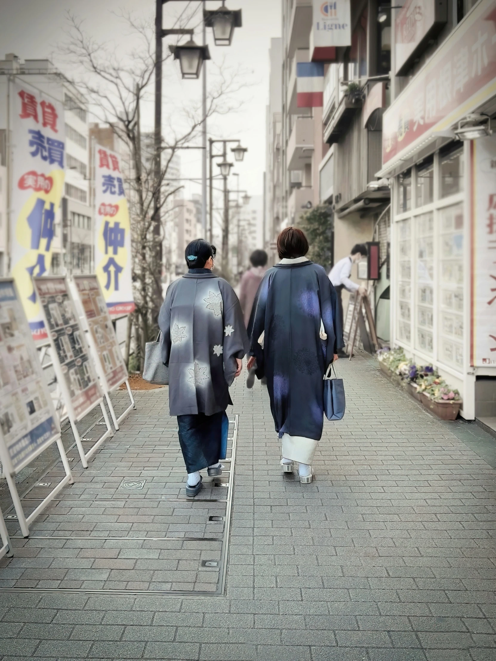 people walk down the street by signs in different languages