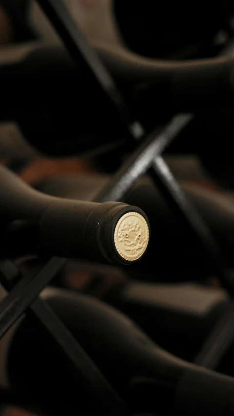 a close up of many wine bottles sitting in rows