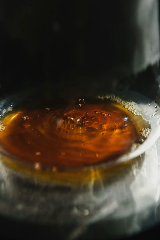 the sauce is being stirred in a large pot