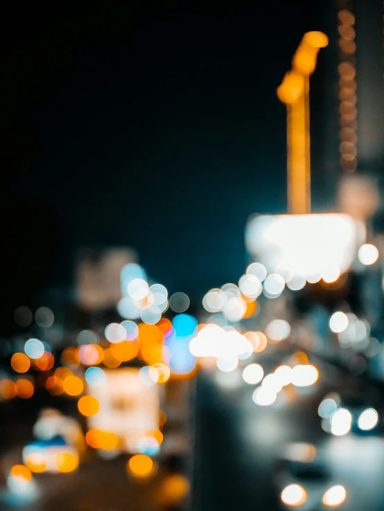 blurry po of cars and buildings at night