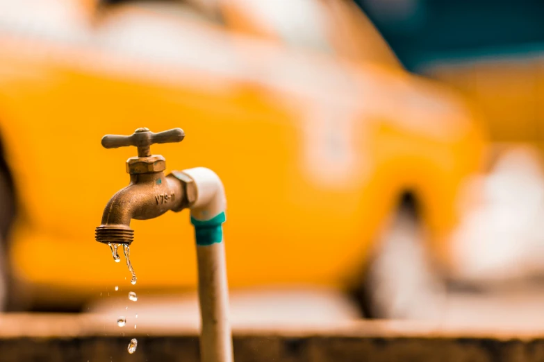 an odd looking faucet with water running out of it