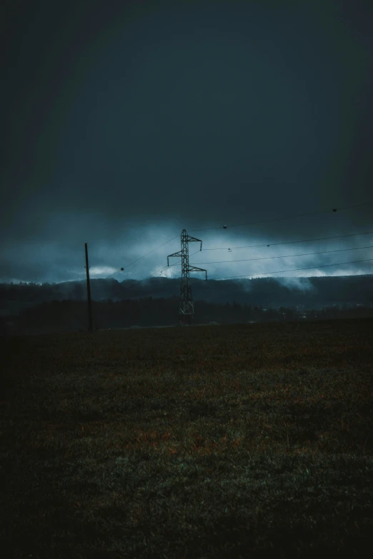 a dark stormy sky with clouds and birds flying by