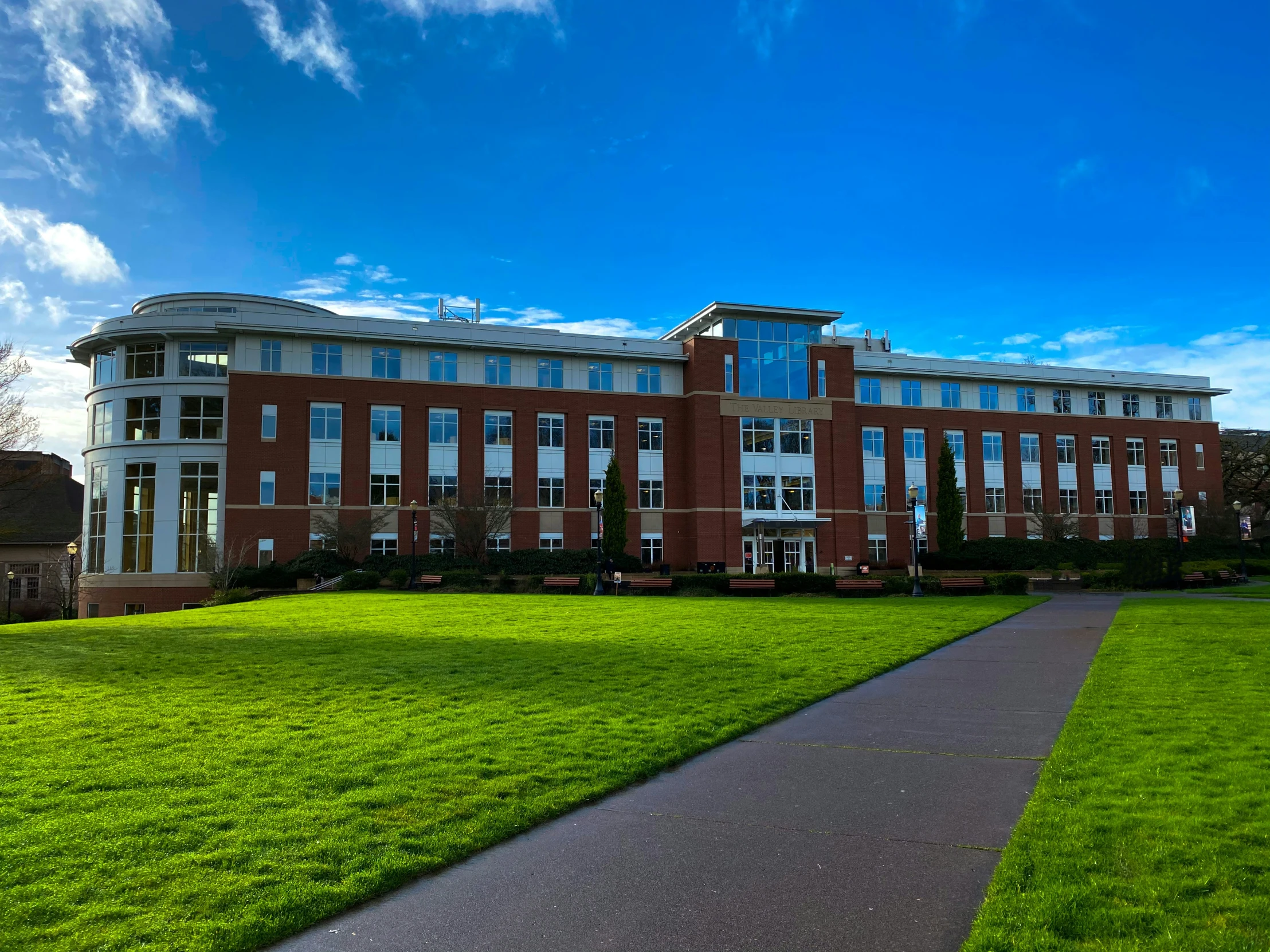 an elegant university building is shown on a clear day