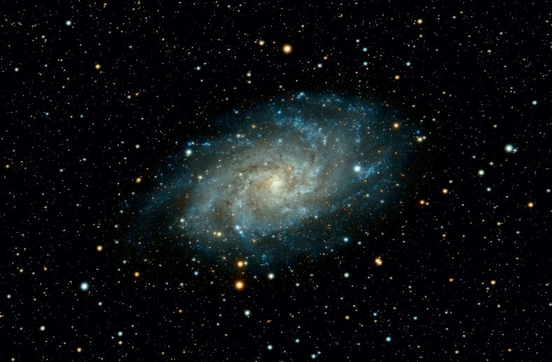 a blue spiral galaxy with stars in the background