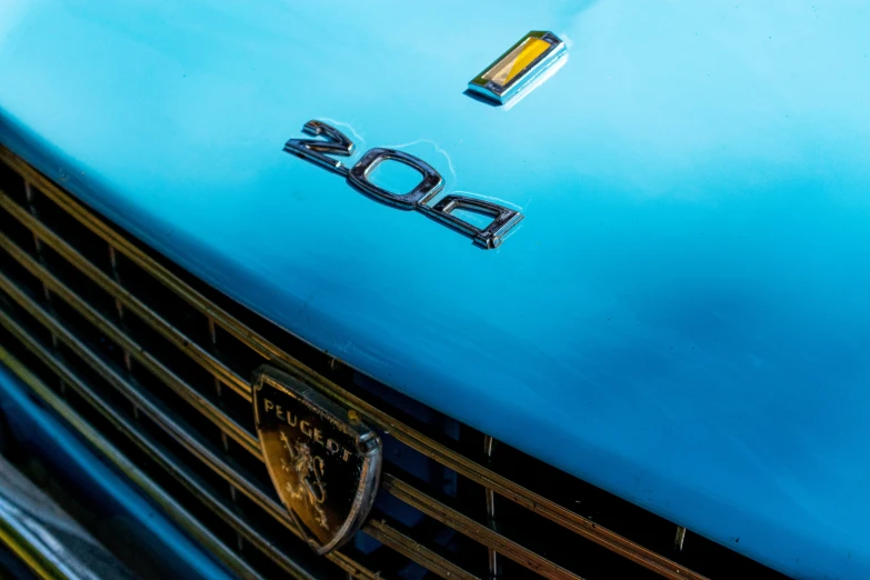 a close up of the emblem on a vintage car