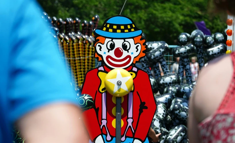 the clown is a paper toy that looks like it has a star on its arm