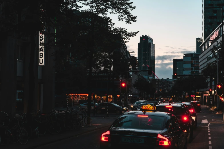 a city street filled with traffic at night