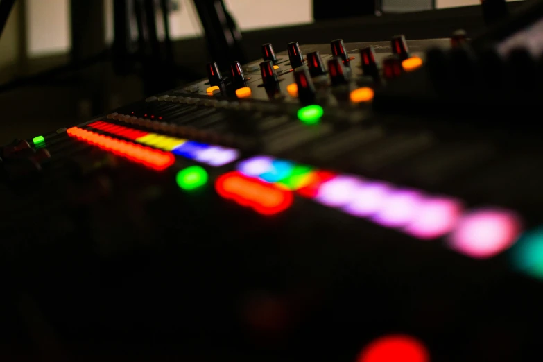 many lights are seen on top of the mixing table