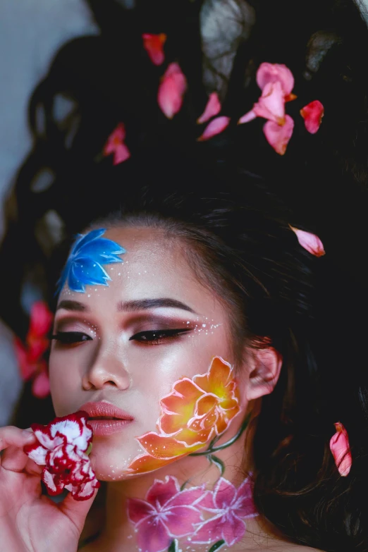 a girl with flowers painted on her face