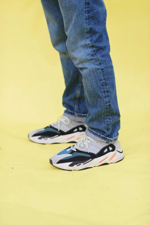 the feet of a person in sneakers stand upright