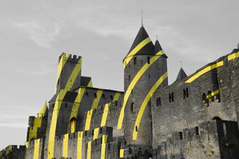 large castle like building with yellow streaks on it