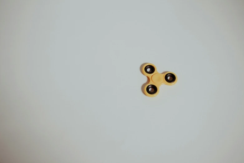 three pairs of black plastic eyeballs on a white background