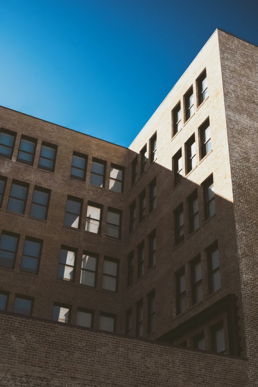 a large tall brick building with lots of windows