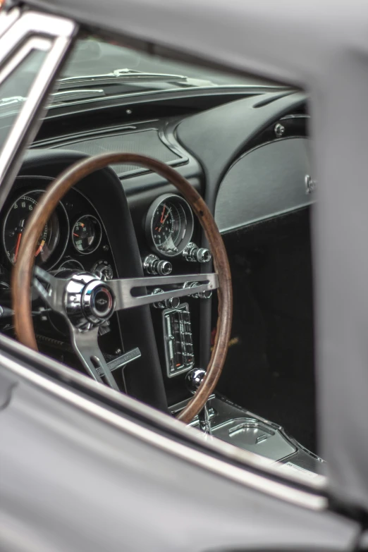 the interior of a classic car showing its dashboard