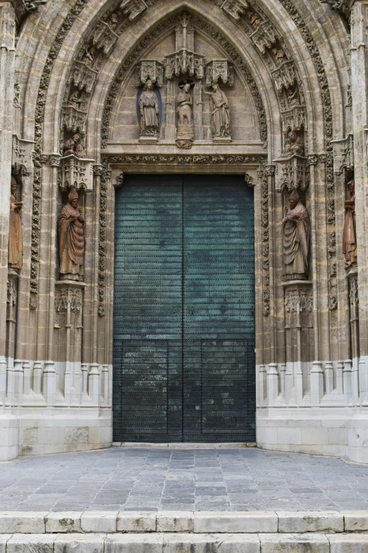 a huge ornate building with a blue door