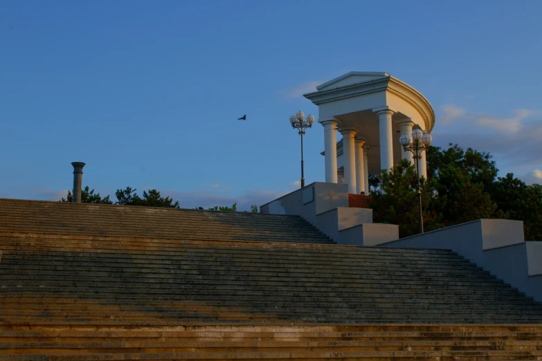 a building with an archway and steps in front of it