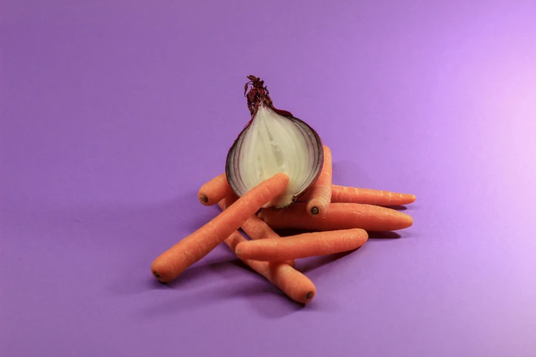 a bunch of carrots sitting in the middle of a pile