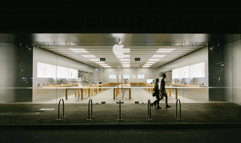 a view of an apple store in the dark