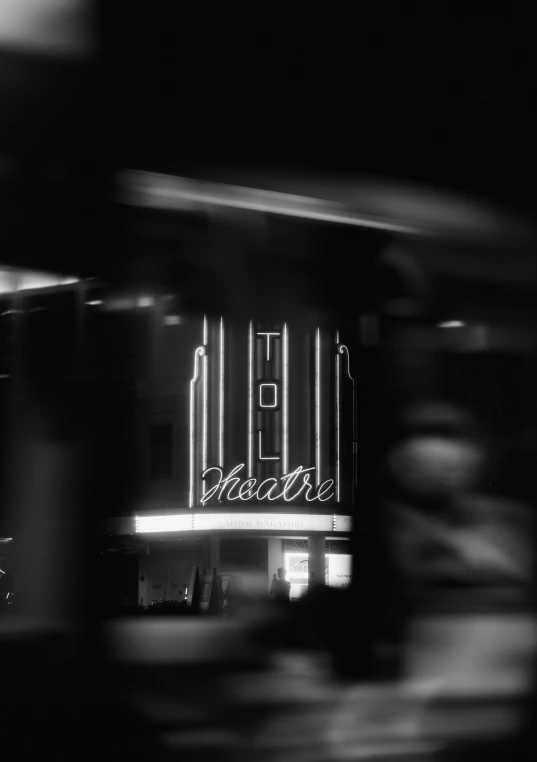 a black and white po of a neon sign