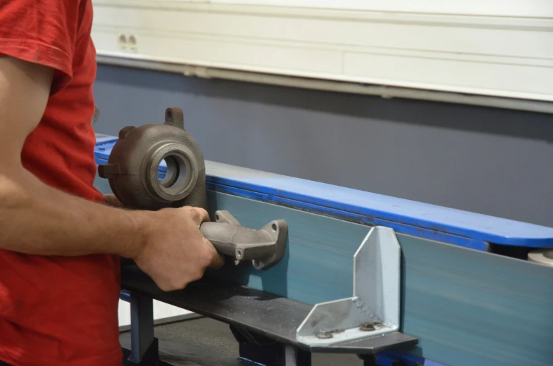 a man with a grinder in his hands working on soing