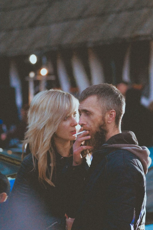 a man and a woman that are standing in the dirt