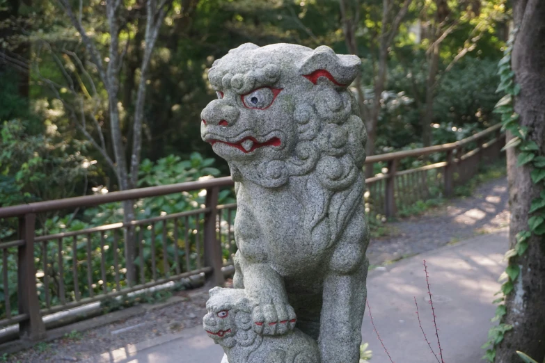 a stone foo foo with large eyes on its head