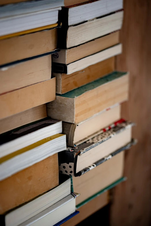 a stack of books with a remote on top