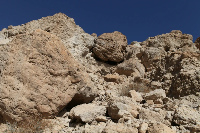 a hill of rocks are shown against the sky