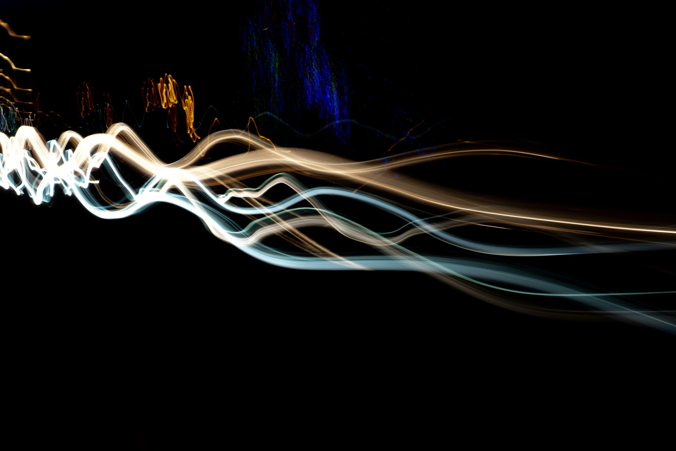 light streaks are shown as they move across the black background