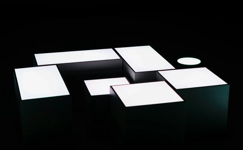 white square shapes are illuminated up against the black background