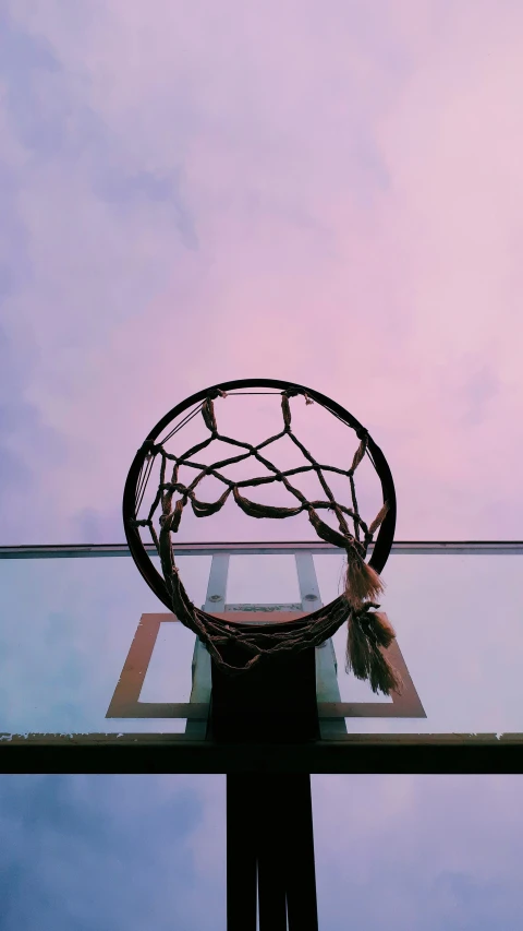 a basketball is hanging from the back rim of a hoop