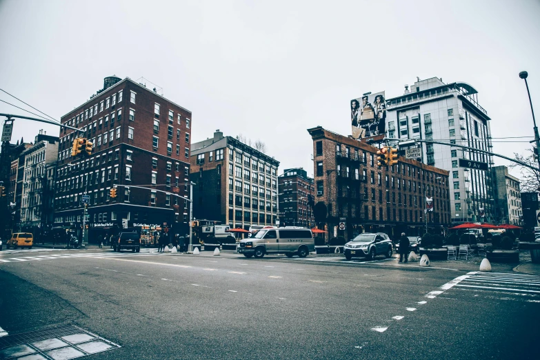 a large city with cars parked along a street