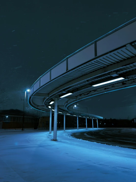 a snow covered parking space with street lights