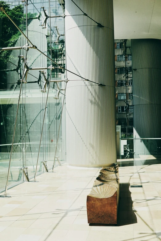 a suitcase on a walkway in front of some tall building