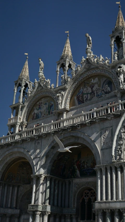 an ornate building has a blue sky in the background