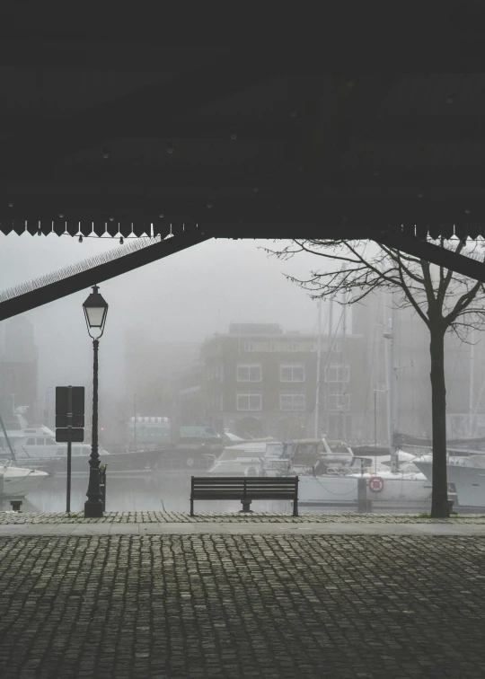 a park bench sitting in front of a light post