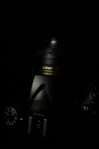 a camera on a dark surface with the flash lit up