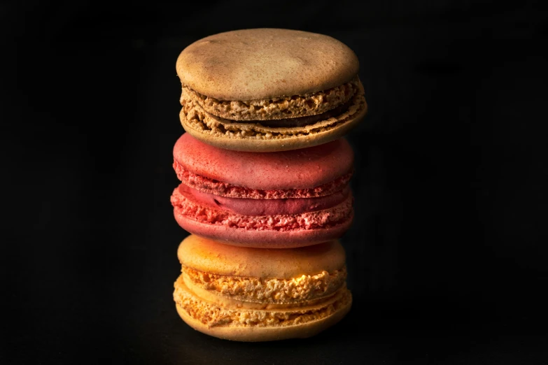 a stack of colorful macaroons stacked together