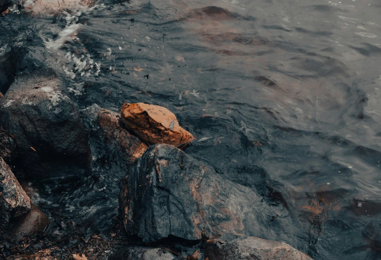 a rock and a water way near some rocks